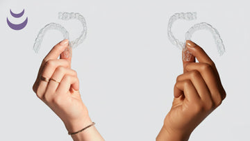 2 Hands holding 2 night guards each