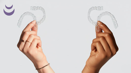 2 Hands holding 2 night guards each